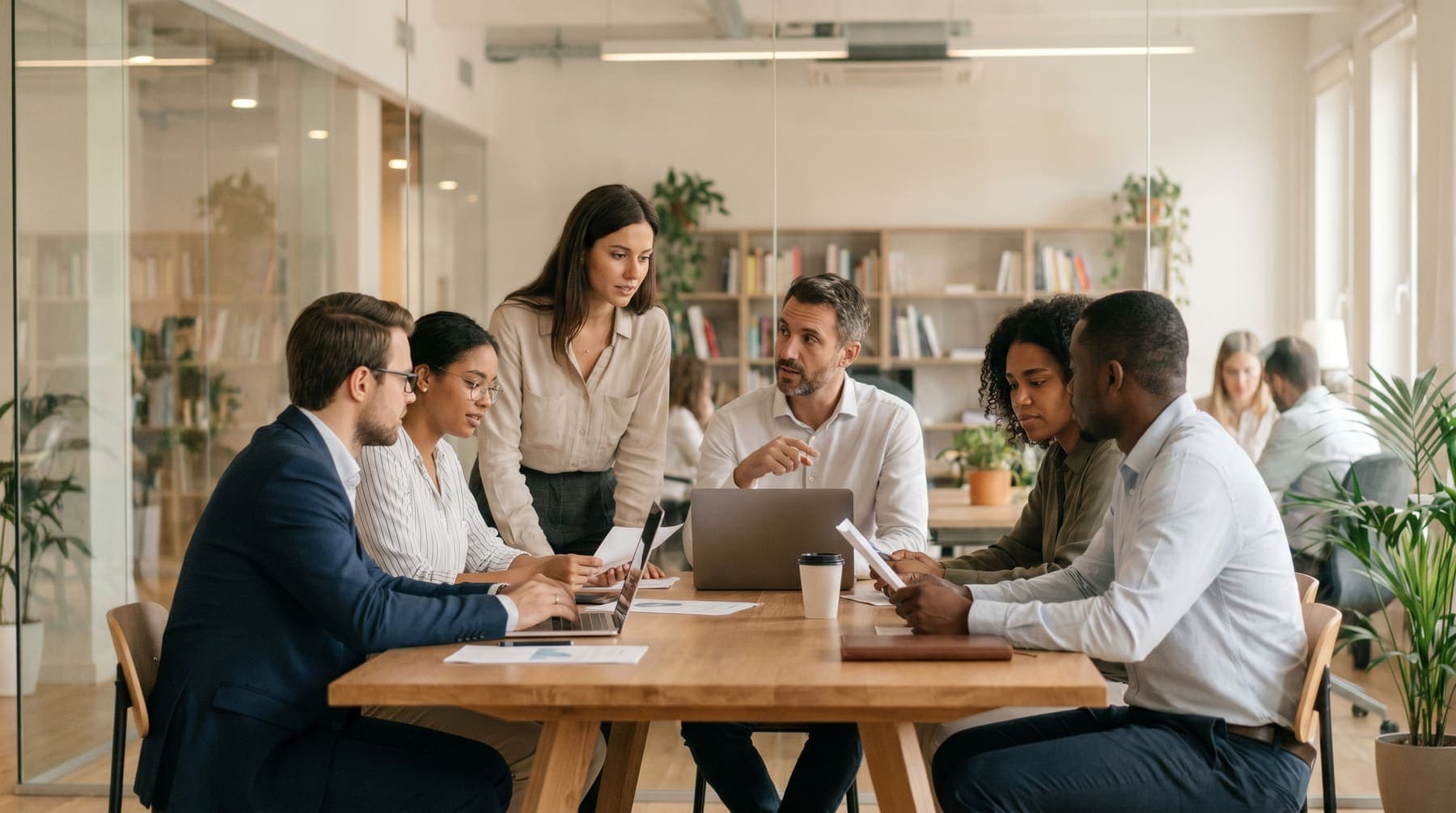 RC Solutions-style professional team collaboration in a modern office.