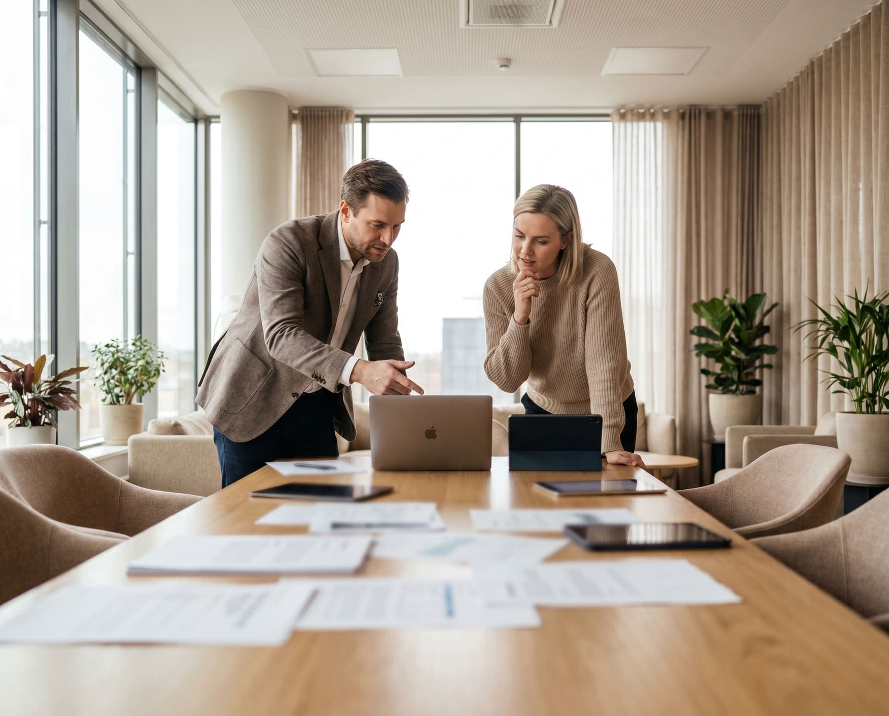 Hiring manager and consultant reviewing technology staffing options together.